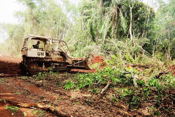 Indonesian military bulldozer preparing the Dungu-Duru road